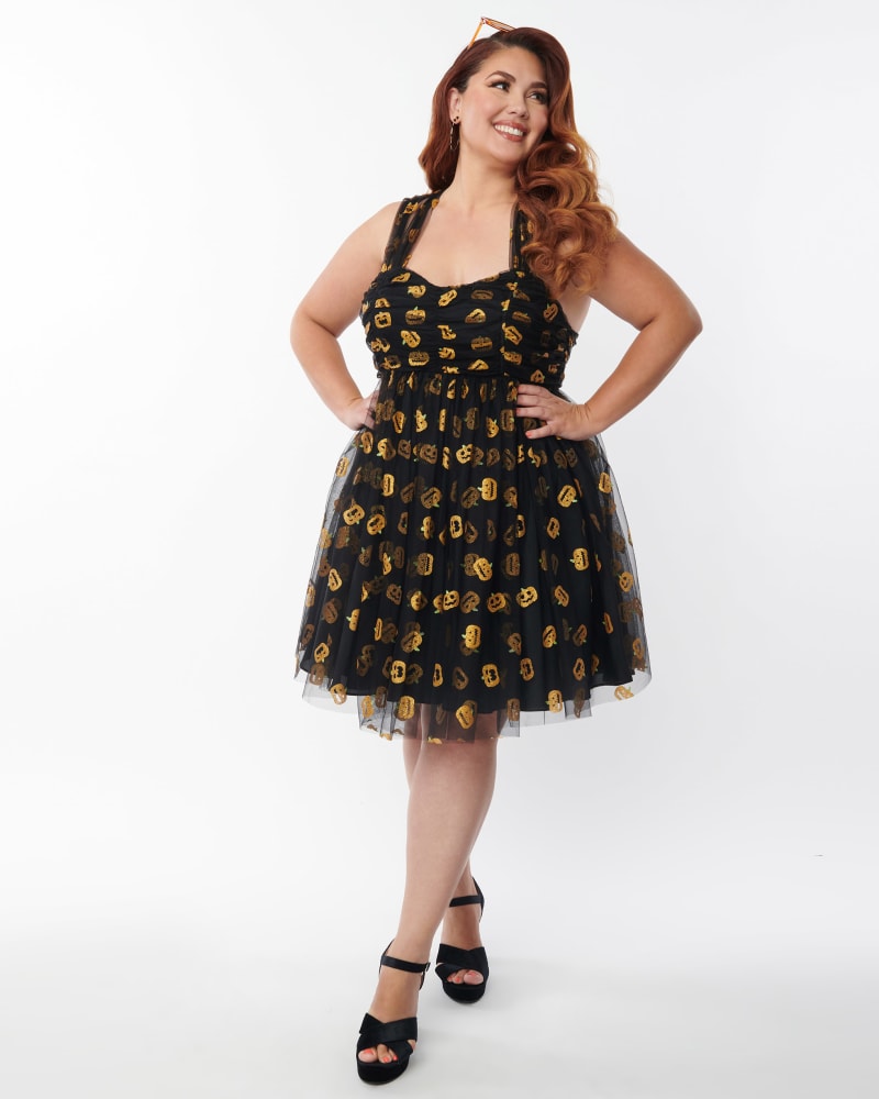 Front of a model wearing a size 3X Unique Vintage Plus Size Black & Pumpkin Print Babydoll Dress in Black by Unique Vintage. | dia_product_style_image_id:300530